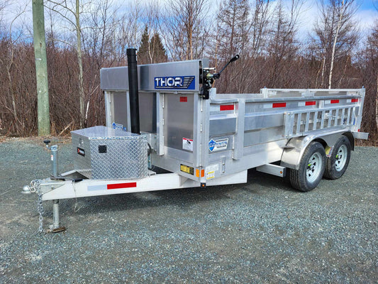 Aluminum dump trailer front angle view highlighting frame, LED lights, and durable aluminum build.