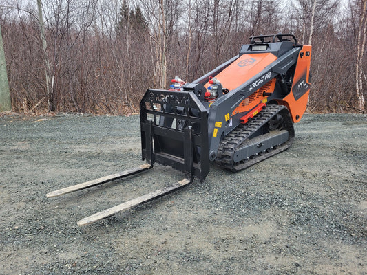 ATL 1000 Mini Track Loader with forks attachment ready for lifting.