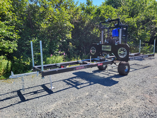Angled view of the Black Rebel Sawmill highlighting its portable bandsaw setup.