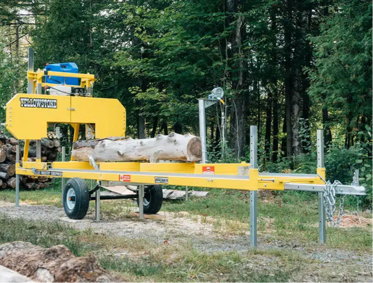 Yellow log splitting Yellowstone Vallee Sawmill in a forest setting