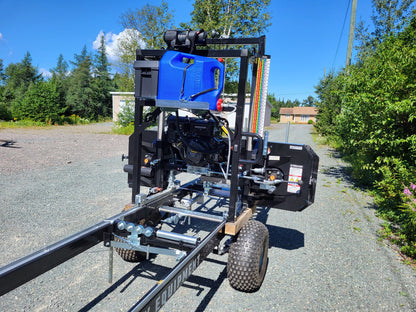 Closeup of the cutting head on the Black Rebel Sawmill with blade guides and control system.
