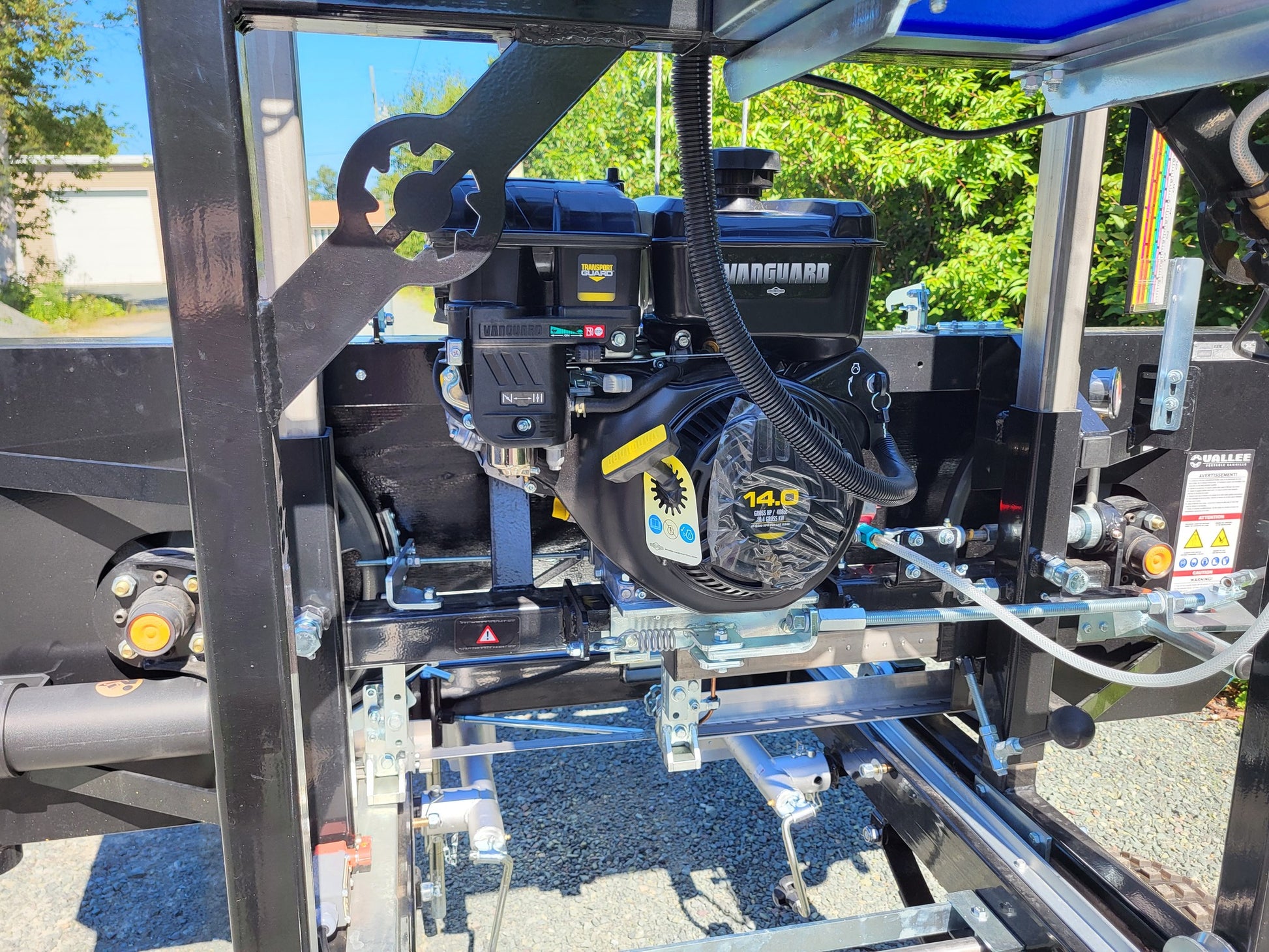 Engine closeup of the Black Rebel Sawmill showing Vanguard 14 HP motor and hydraulic components.